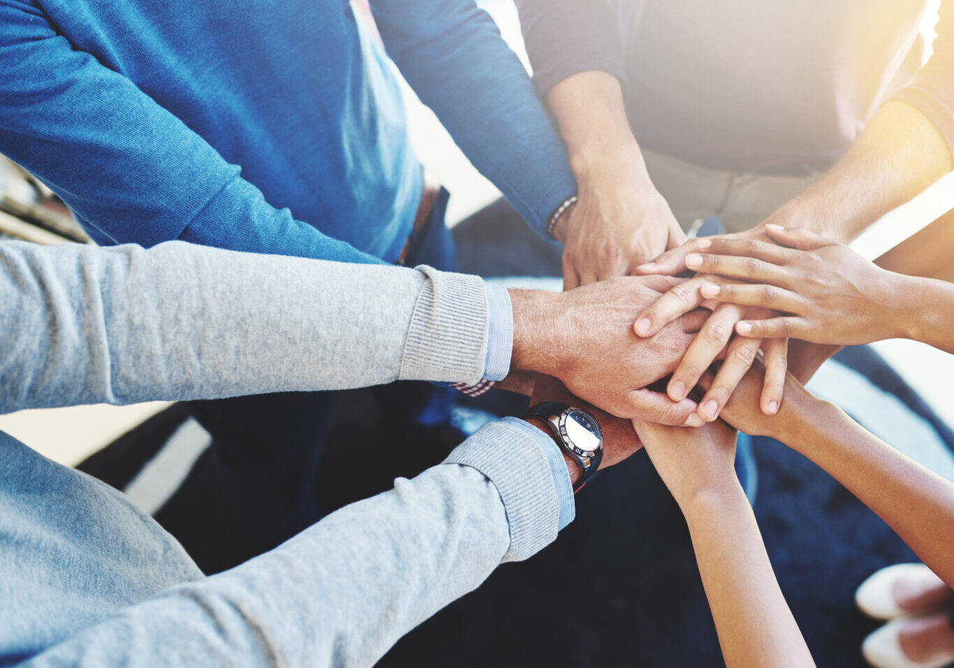 cropped-shot-of-a-group-of-businesspeople-standing-2022-12-31-04-22-22-utc Cropped shot of a group of businesspeople standing in a huddle with their hands stacked.